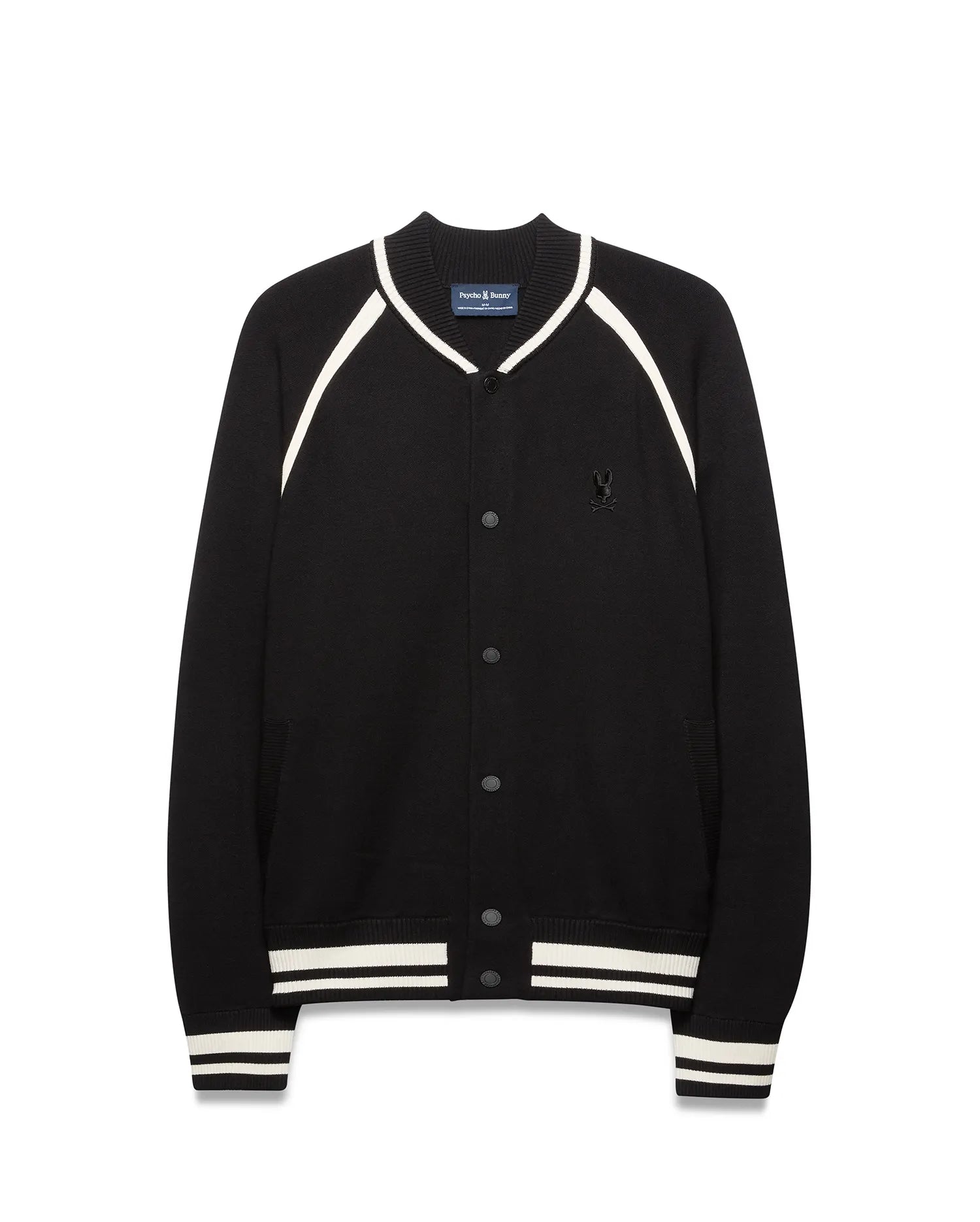 Mens Rafferty Cardigan: Black knit varsity cardigan with white stripe accents on ribbed collar, raglan sleeves, cuffs, and hem, featuring snap buttons and a small embroidered Psycho Bunny skull logo on the left chest.