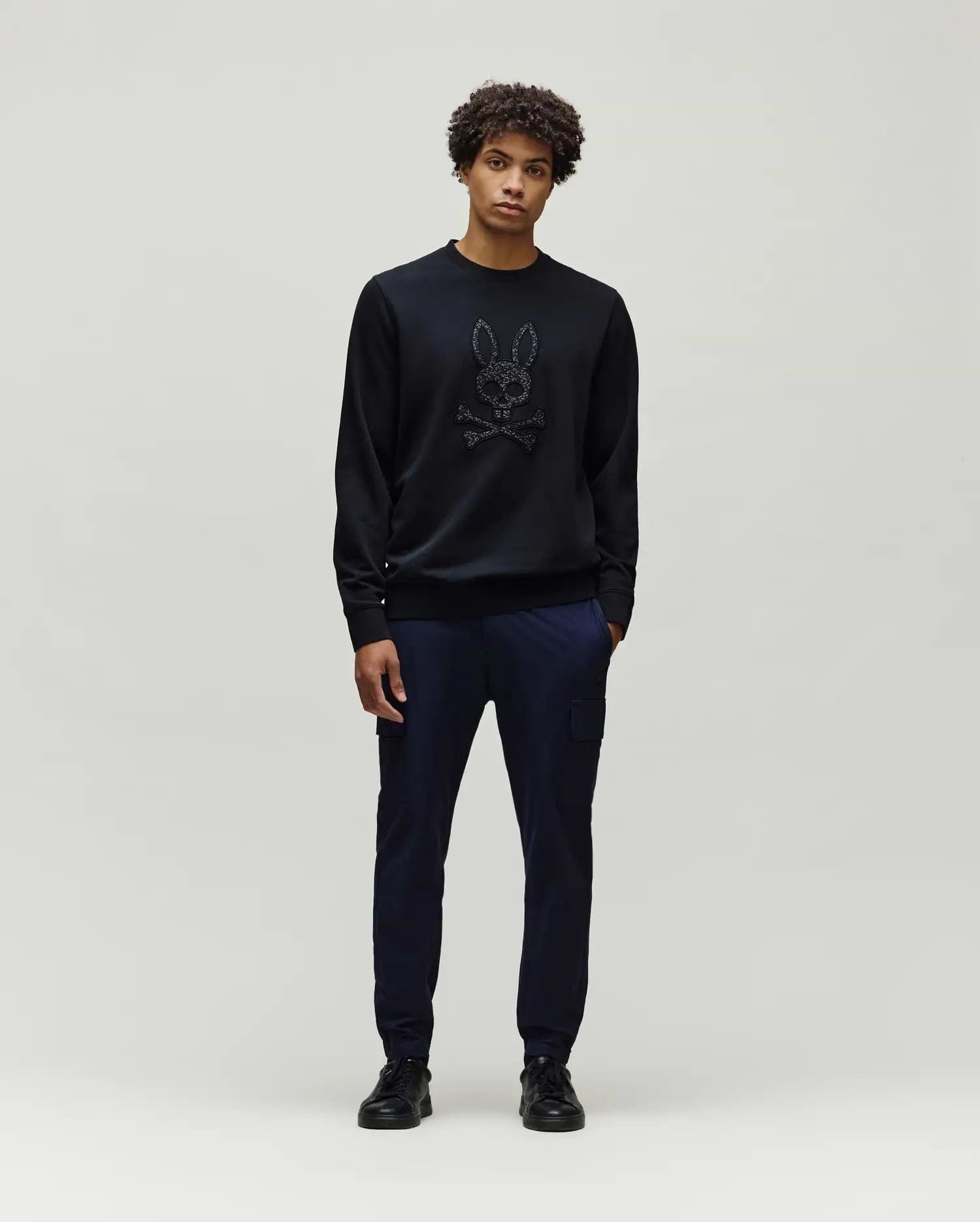 Mens Gabin Textured Crew black classic fit crewneck sweatshirt featuring a large, textured black Psycho Bunny skull and crossbones logo centrally on the chest.