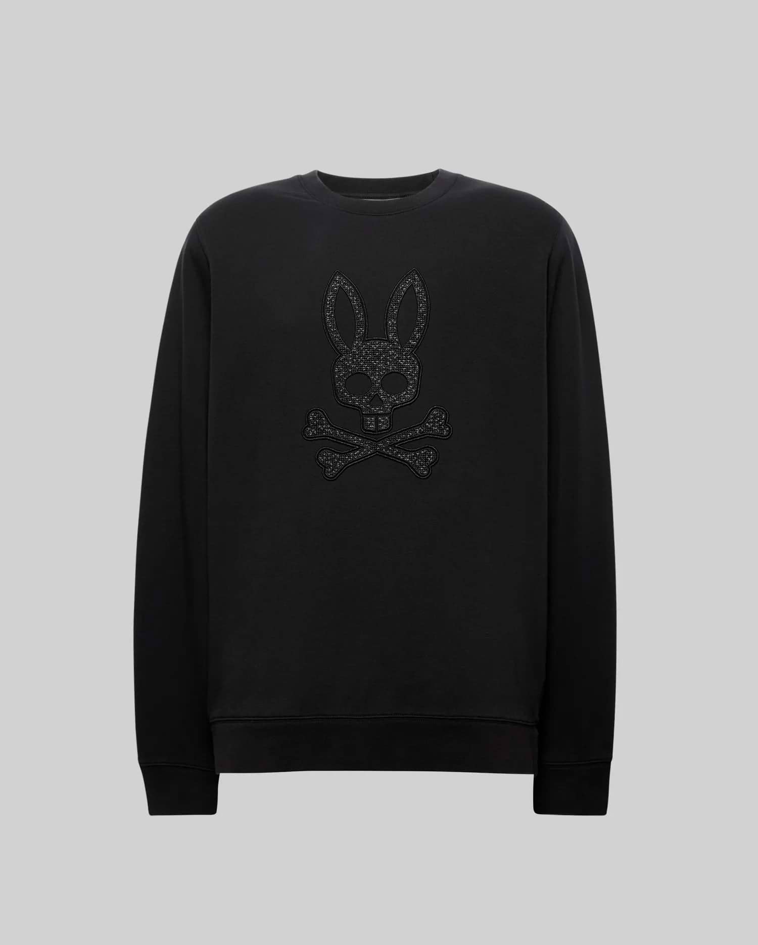 Black Mens Gabin Textured Crew sweatshirt in a soft jersey knit, classic fit, featuring a large, textured black Psycho Bunny skull and crossbones logo embroidered on the chest.