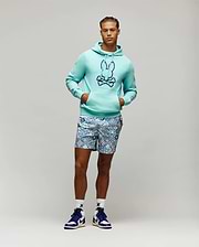 Aqua French terry Mens Gage Patch Hoodie, classic fit, with a large embroidered dark blue Psycho Bunny skull logo on the chest, paired with patterned blue and white shorts and white logo socks.