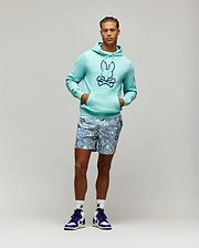 Aqua French terry Mens Gage Patch Hoodie, classic fit, with a large embroidered dark blue Psycho Bunny skull logo on the chest, paired with patterned blue and white shorts and white logo socks.