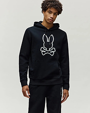 Black Mens Gage Patch Hoodie in relaxed fit french terry, featuring a large white embroidered Psycho Bunny skull logo with zigzag stitching on the chest and a front kangaroo pocket.