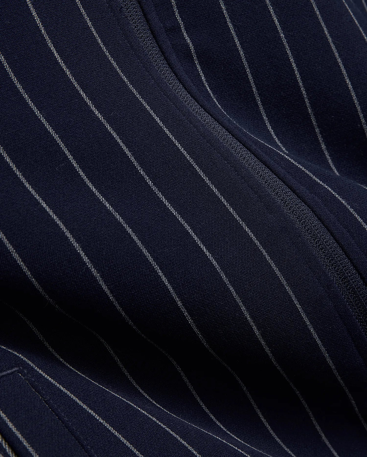 Mens Harland Double Weave Chalk Stripe Track Jacket in navy, featuring subtle white pinstripes and a textured zipper, highlighting its premium double weave fabric. (7)