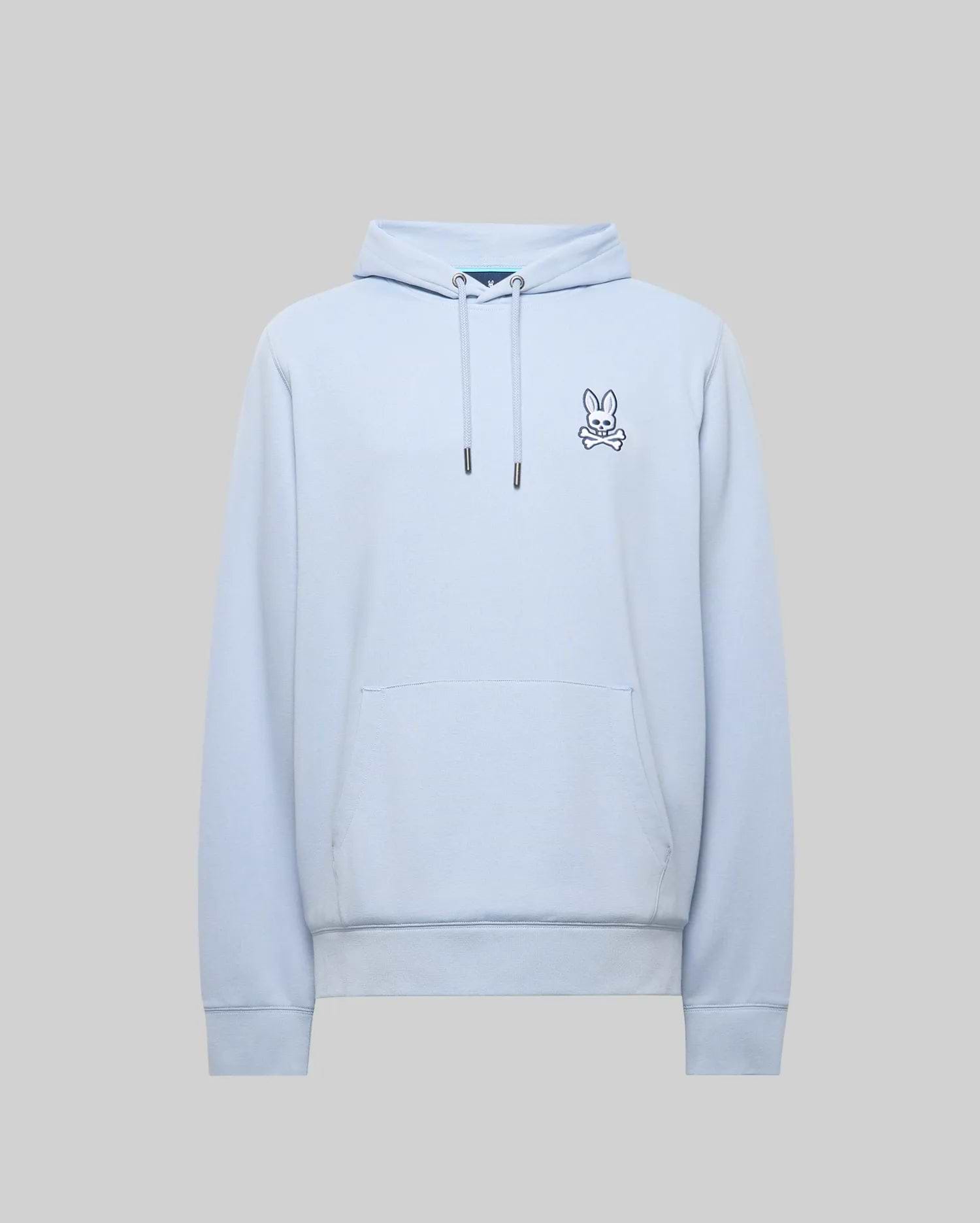 Mens Timothy 4k Bunny Hoodie, light blue classic fit hoodie in soft jersey fabric, featuring a small embroidered navy and white Psycho Bunny skull logo on the left chest, drawstring hood, and kangaroo pocket.