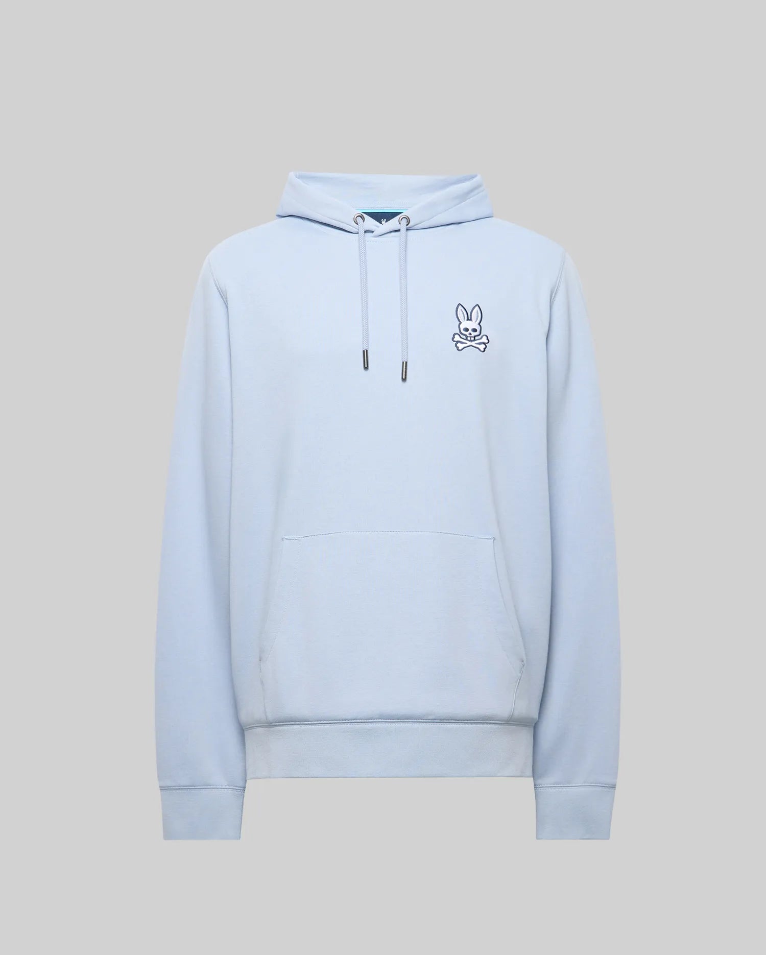 Mens Timothy 4k Bunny Hoodie, light blue classic fit hoodie in soft jersey fabric, featuring a small embroidered navy and white Psycho Bunny skull logo on the left chest, drawstring hood, and kangaroo pocket.