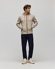Mens Maxton Waffle Full Zip Hoodie in beige waffle knit with a subtle brown pattern, featuring a brown full zip, hood lining, and pocket trim, with a small embroidered Psycho Bunny skull logo on the left chest.