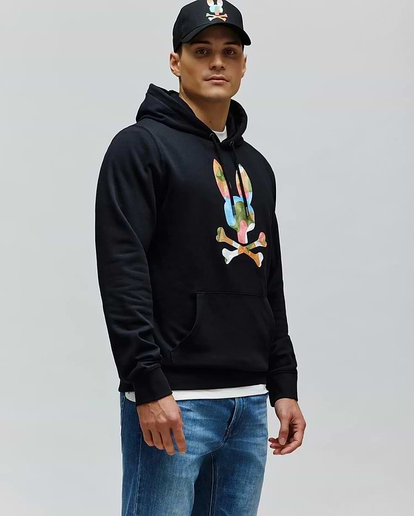 Mens Ara Hoodie, a black classic fit French terry hoodie featuring a large, vibrant multi-color Psycho Bunny skull and crossbones logo on the chest, with a drawstring hood and kangaroo pocket.