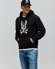 Black Mens Ara Hoodie, a classic fit French terry pullover, showcasing a prominent multicolor camouflage Psycho Bunny skull logo on the central chest.