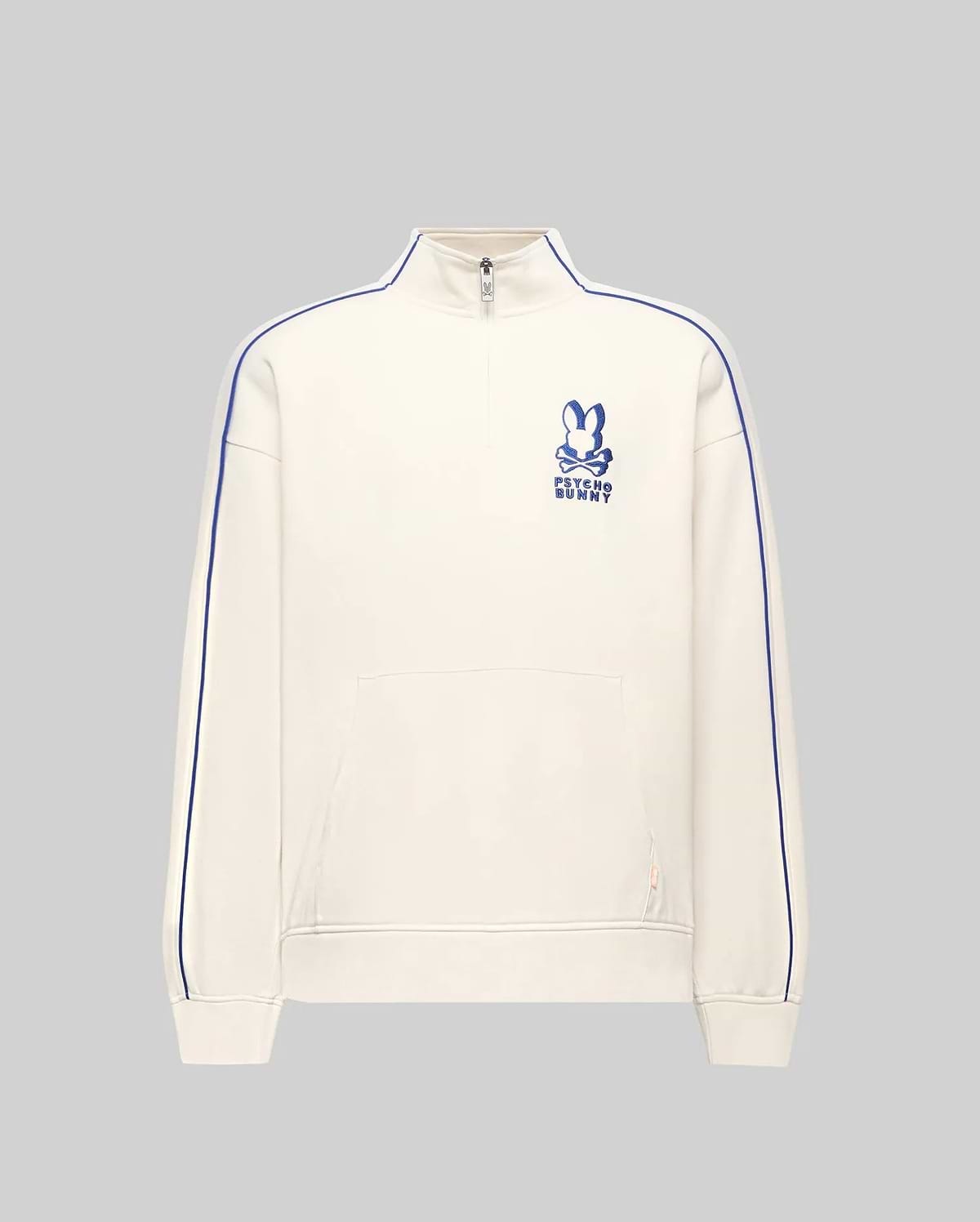 Mens Toby 1/4 Zip in cream French terry, relaxed fit, with blue vertical sleeve piping, a kangaroo pocket with orange tag, and an embroidered blue Psycho Bunny logo on the left chest.