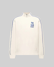 Mens Toby 1/4 Zip in cream French terry, relaxed fit, with blue vertical sleeve piping, a kangaroo pocket with orange tag, and an embroidered blue Psycho Bunny logo on the left chest.