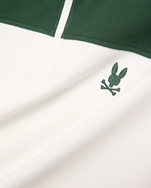 Mens Gabe French Terry 1/4 Zip, a white and dark green color-block design with a small, embroidered dark green Psycho Bunny skull logo on the chest. Soft French terry fabric. (7)