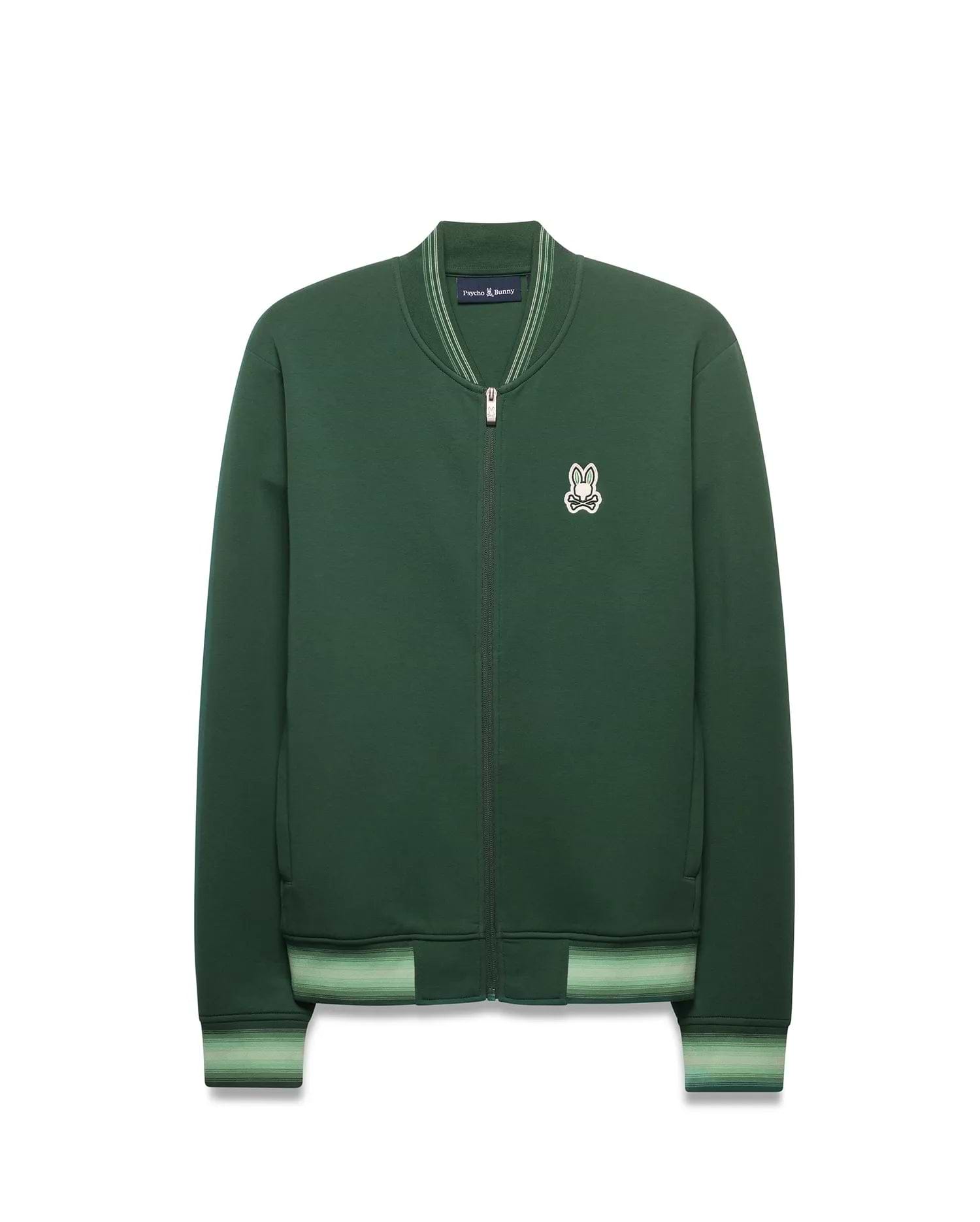 Mens Jaydon Track Jacket in forest green, featuring a full-zip closure, classic fit, smooth knit fabric, and a small embroidered white Psycho Bunny skull logo on the left chest. Ribbed collar and cuffs have light green stripes.