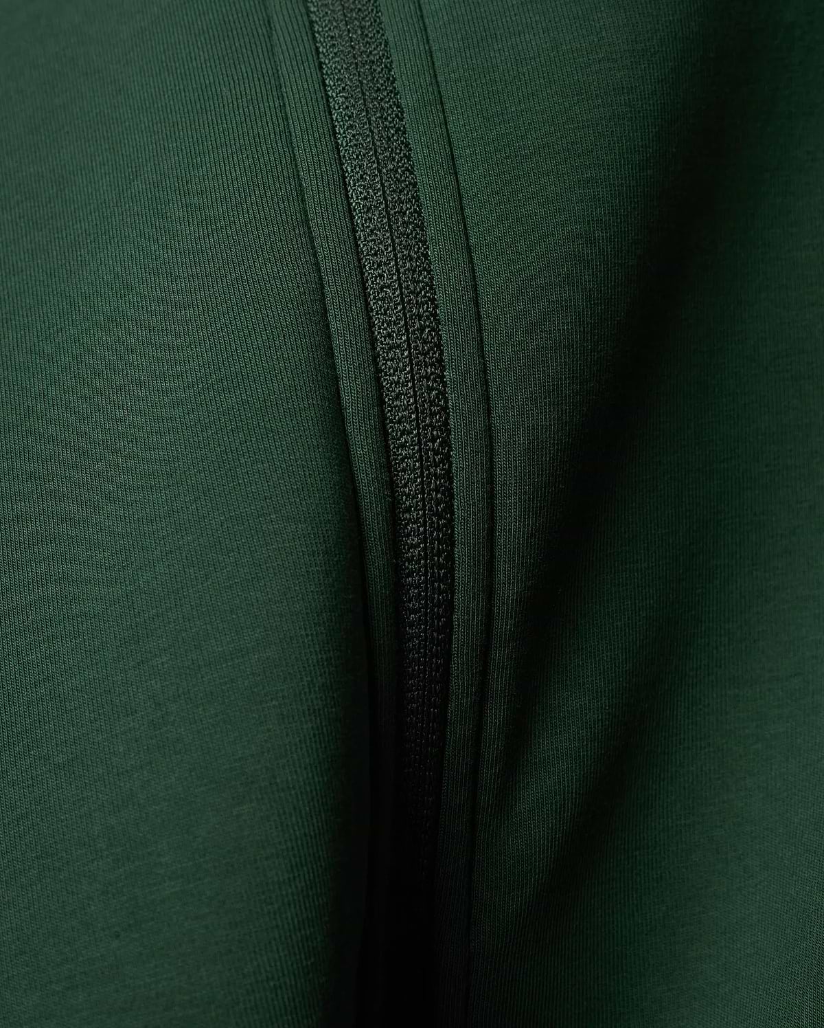 Mens Jaydon Track Jacket in a rich, deep forest green, featuring a prominent tonal zipper closure and a finely textured ribbed knit fabric.