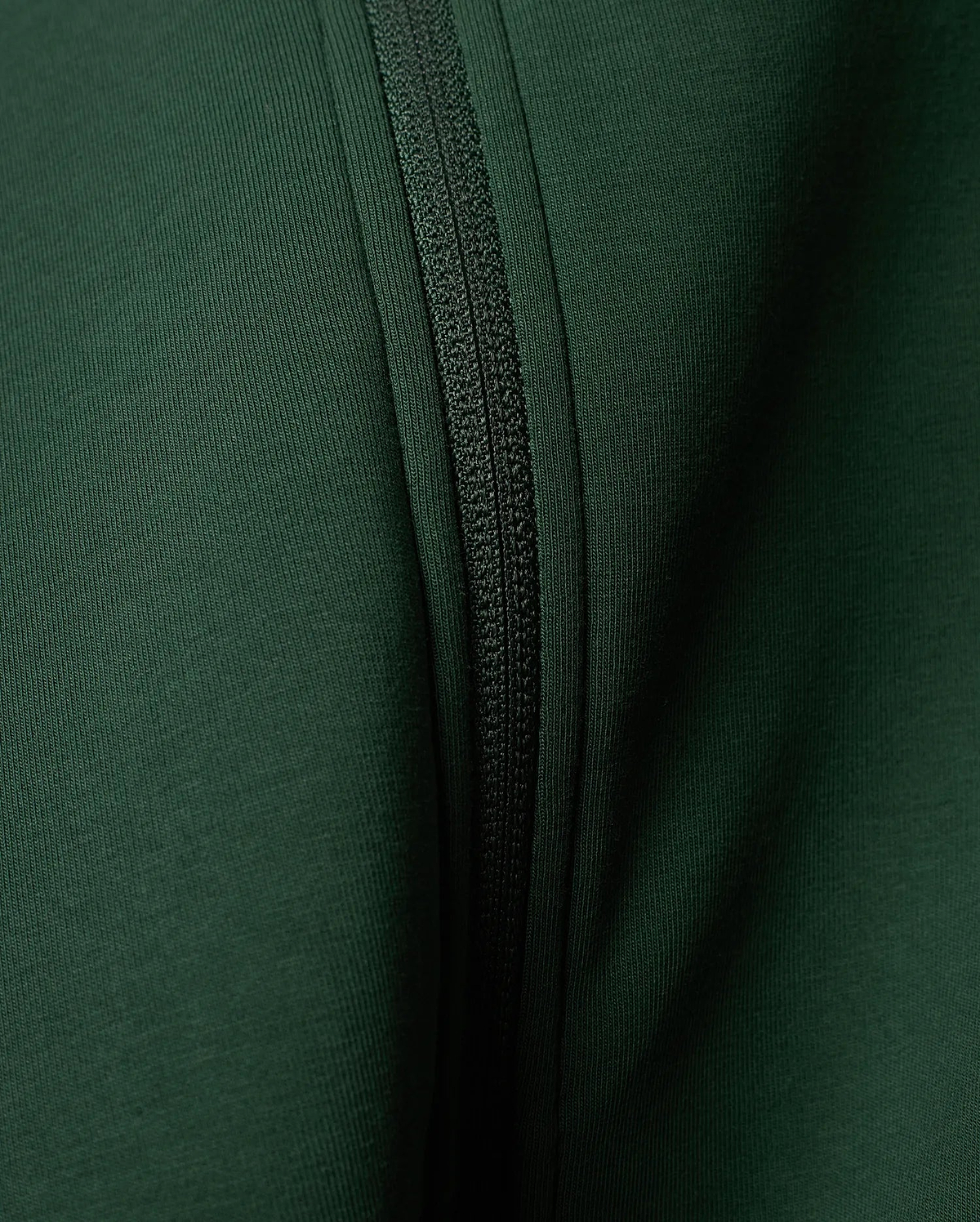 Mens Jaydon Track Jacket in a rich, deep forest green, featuring a prominent tonal zipper closure and a finely textured ribbed knit fabric.