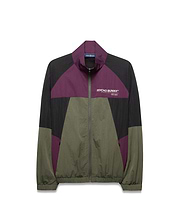 Mens Alder Nylon Colorblock Jacket, a relaxed fit full-zip crinkled nylon jacket in black, purple, and olive green colorblock, with a white Psycho Bunny Designed For Disruption text logo on the left chest.