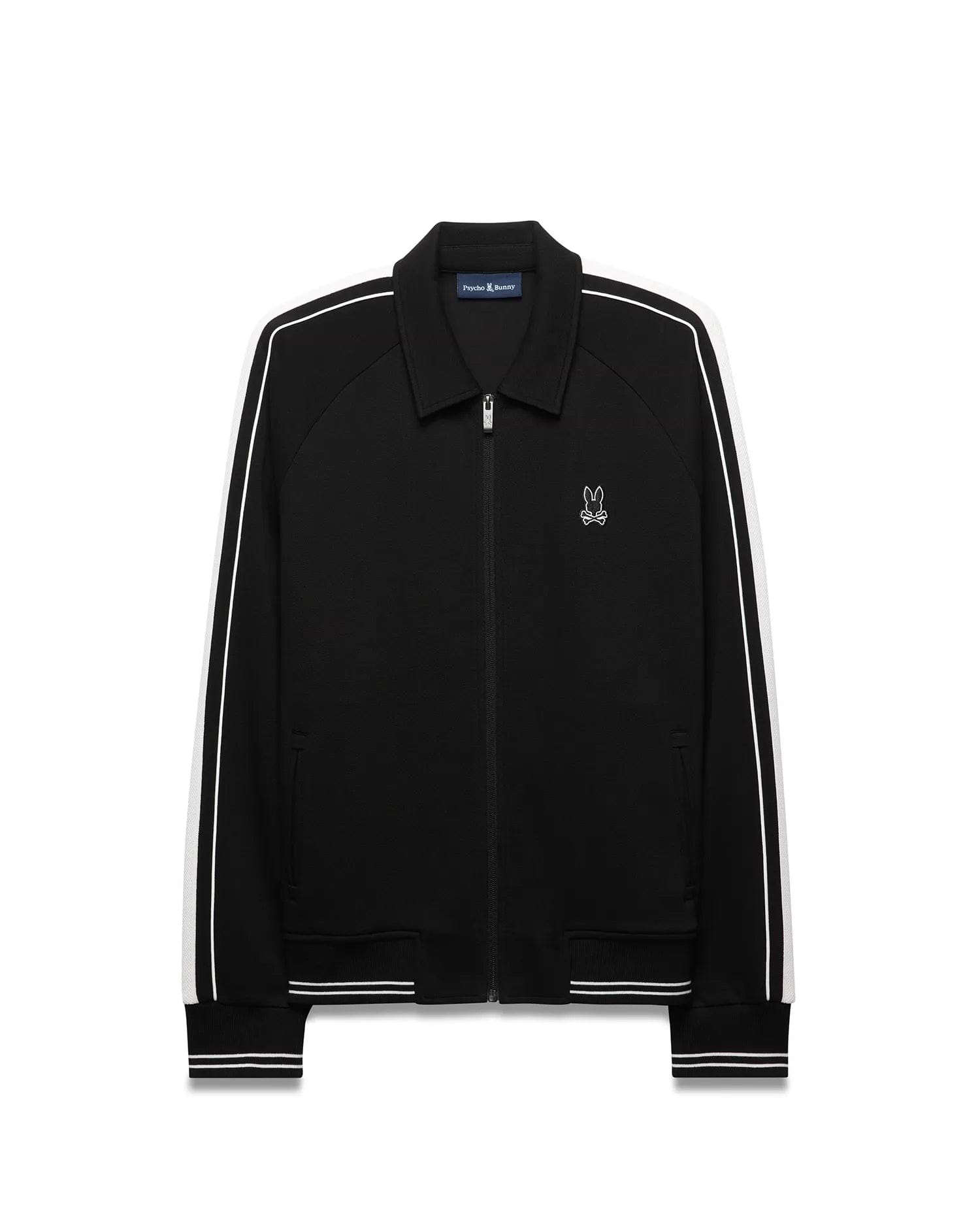 Mens Ceano Track Jacket, black smooth knit with a classic fit, featuring white double stripes on raglan sleeves, ribbed collar, cuffs, and hem, and a small embroidered white Psycho Bunny skull logo on the left chest. (5)