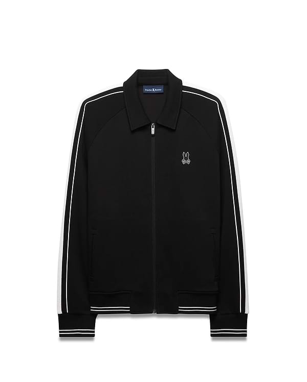 Mens Ceano Track Jacket, black smooth knit with a classic fit, featuring white double stripes on raglan sleeves, ribbed collar, cuffs, and hem, and a small embroidered white Psycho Bunny skull logo on the left chest. (5)