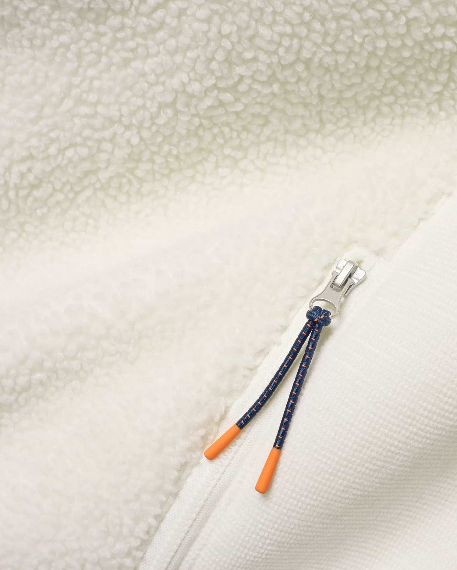 Men's Rowley Sherpa Zip Jacket featuring creamy sherpa fleece and textured knit fabric, a silver zipper, and a navy cord zipper pull with bright orange tips. (6)