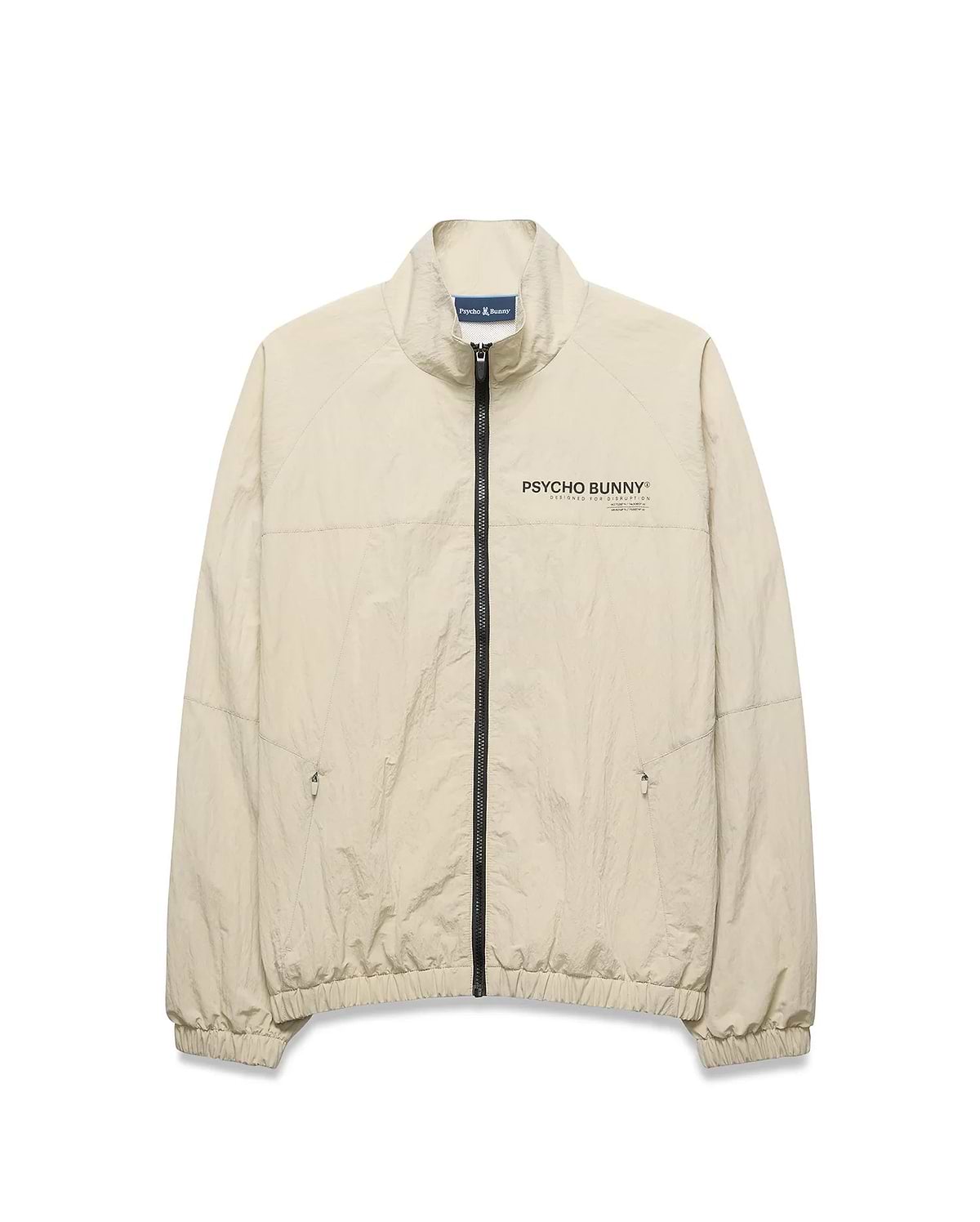 Light beige Mens Alder Nylon Jacket, a classic fit crinkled nylon jacket with full black zip, stand collar, zippered side pockets, elastic cuffs/hem, and a black Psycho Bunny chest logo.