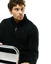 Mens Marc Textured 1/4 Zip in black, featuring a classic fit, textured knit fabric, quarter zip closure with custom pull, and a small tonal embroidered Psycho Bunny skull logo on the left chest.