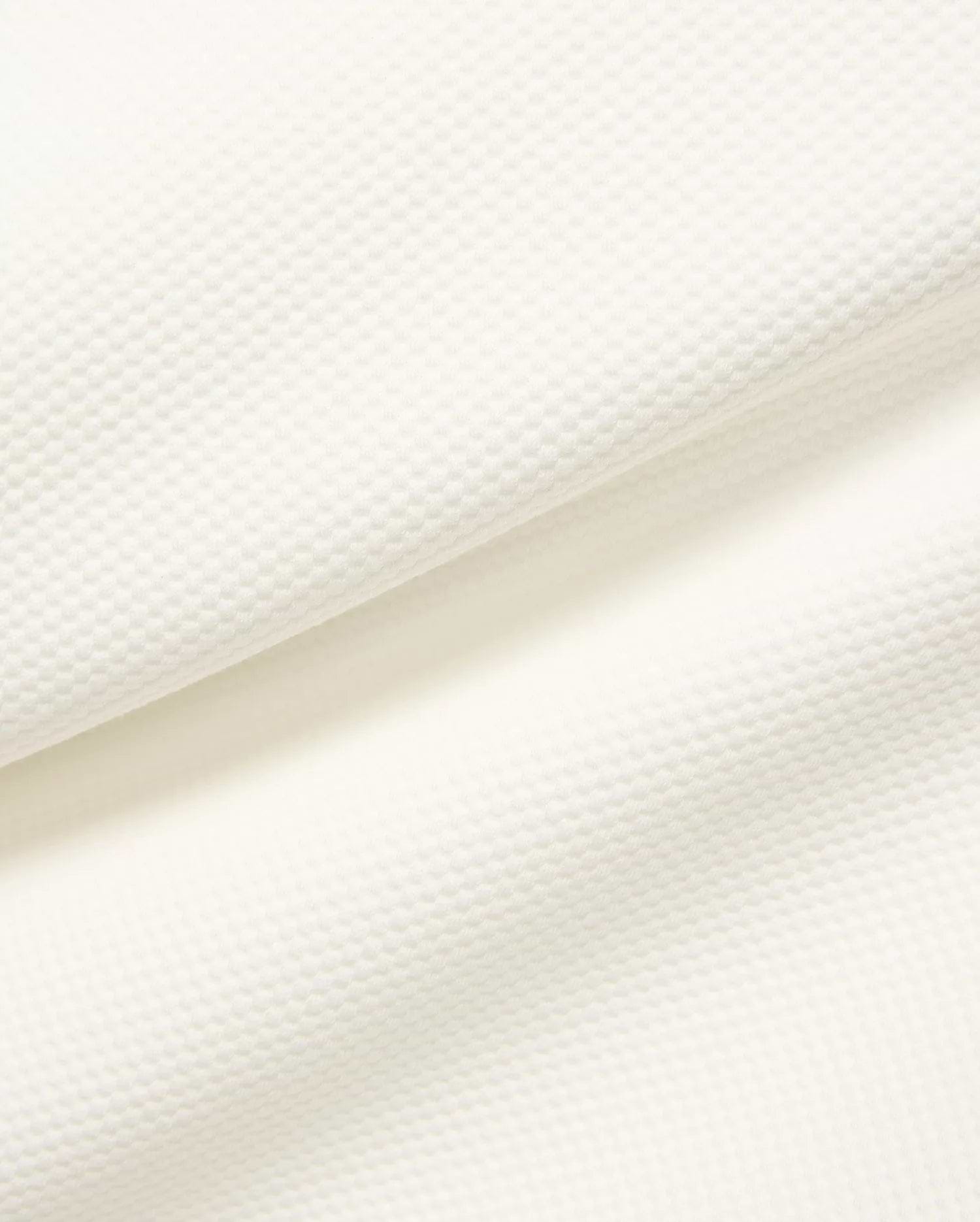 Mens Marc Textured 1/4 Zip in cream, showcasing a premium, subtly textured pique knit fabric with a fine, raised geometric pattern.