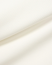 Mens Marc Textured 1/4 Zip in cream, showcasing a premium, subtly textured pique knit fabric with a fine, raised geometric pattern.