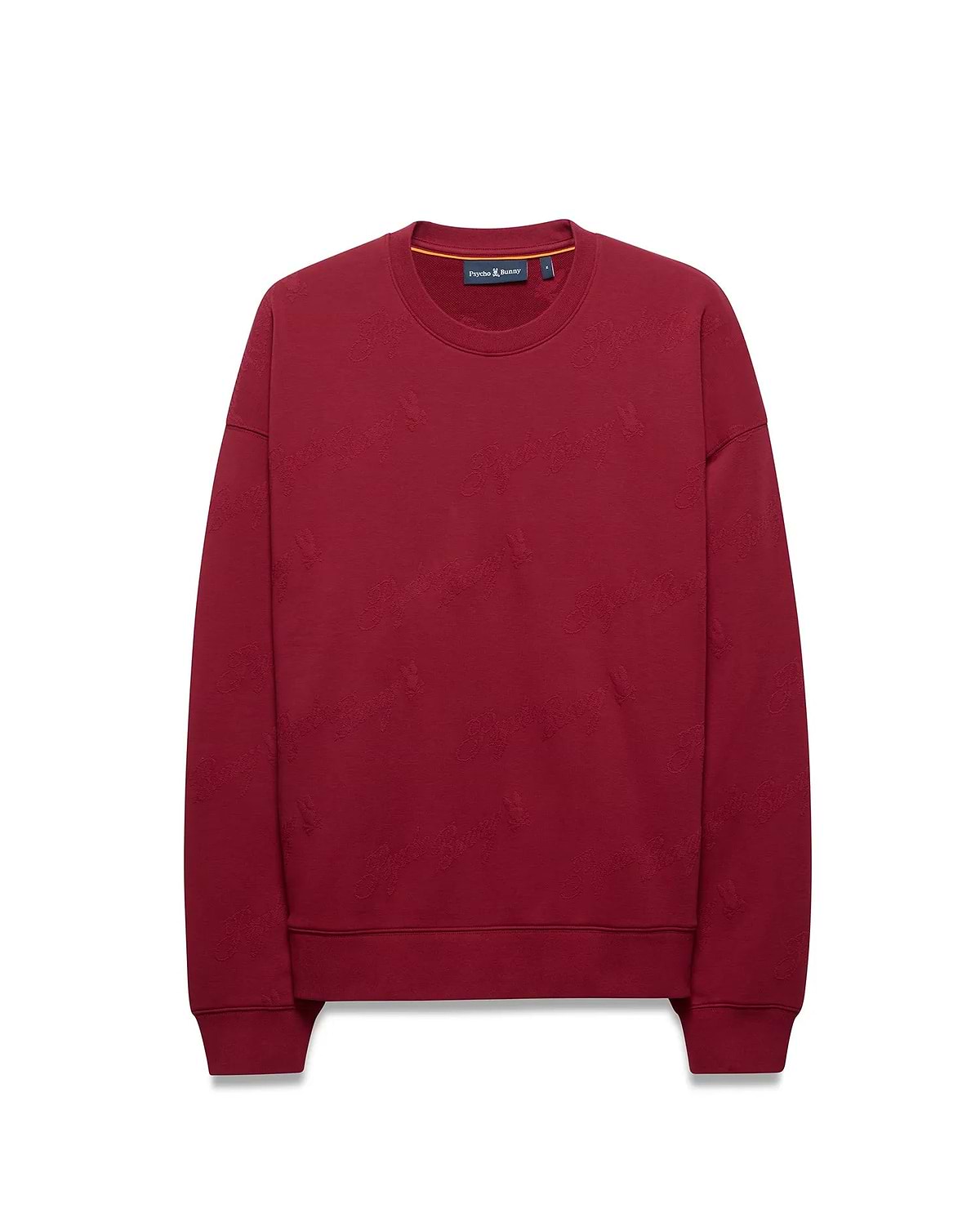 Mens Cedrick All Over Jacquard Crew, a relaxed fit deep red crewneck sweatshirt featuring a subtle all-over jacquard Psycho Bunny skull logo pattern, a small embroidered chest logo, and an orange inner collar stripe.