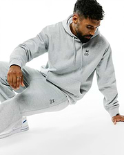 Mens Terrence Fleece Hoodie in heather grey, a relaxed fit fleece hoodie with a drawstring hood, kangaroo pocket, and a small embroidered Psycho Bunny skull logo on the left chest.