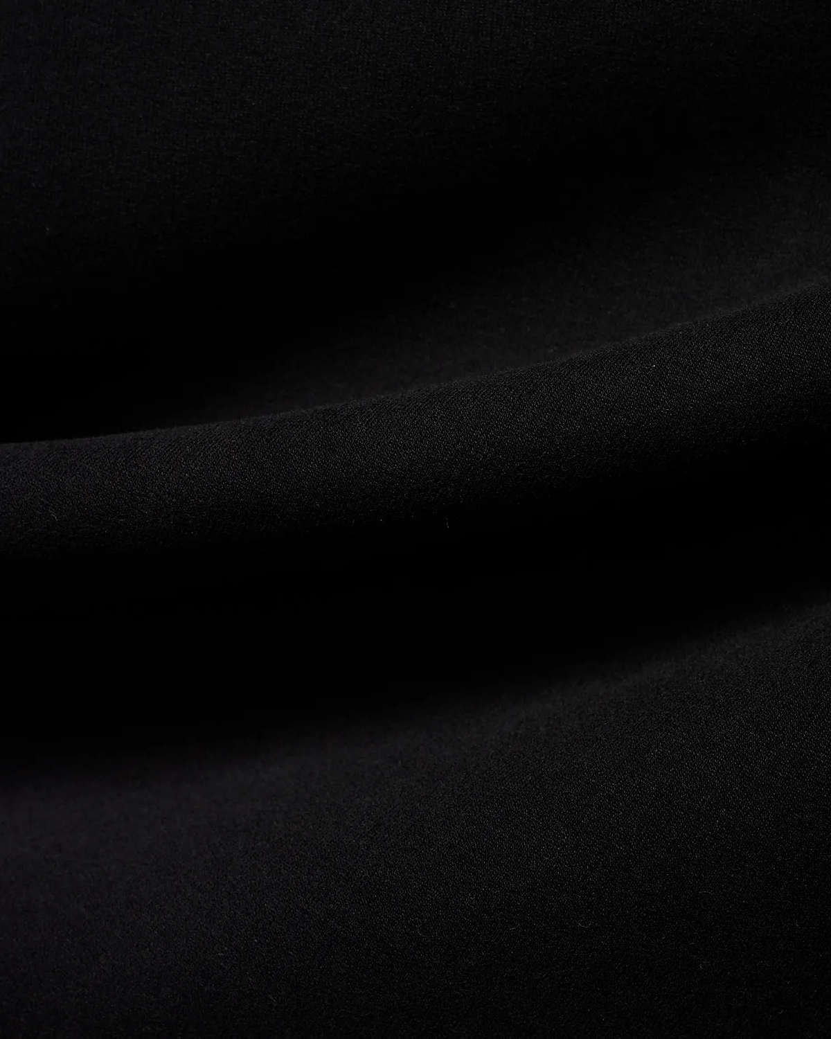 Men's Samson Quarter-Zip Sweater in classic black, crafted from a soft, smooth jersey knit fabric, showcasing its premium texture with subtle folds. (6)