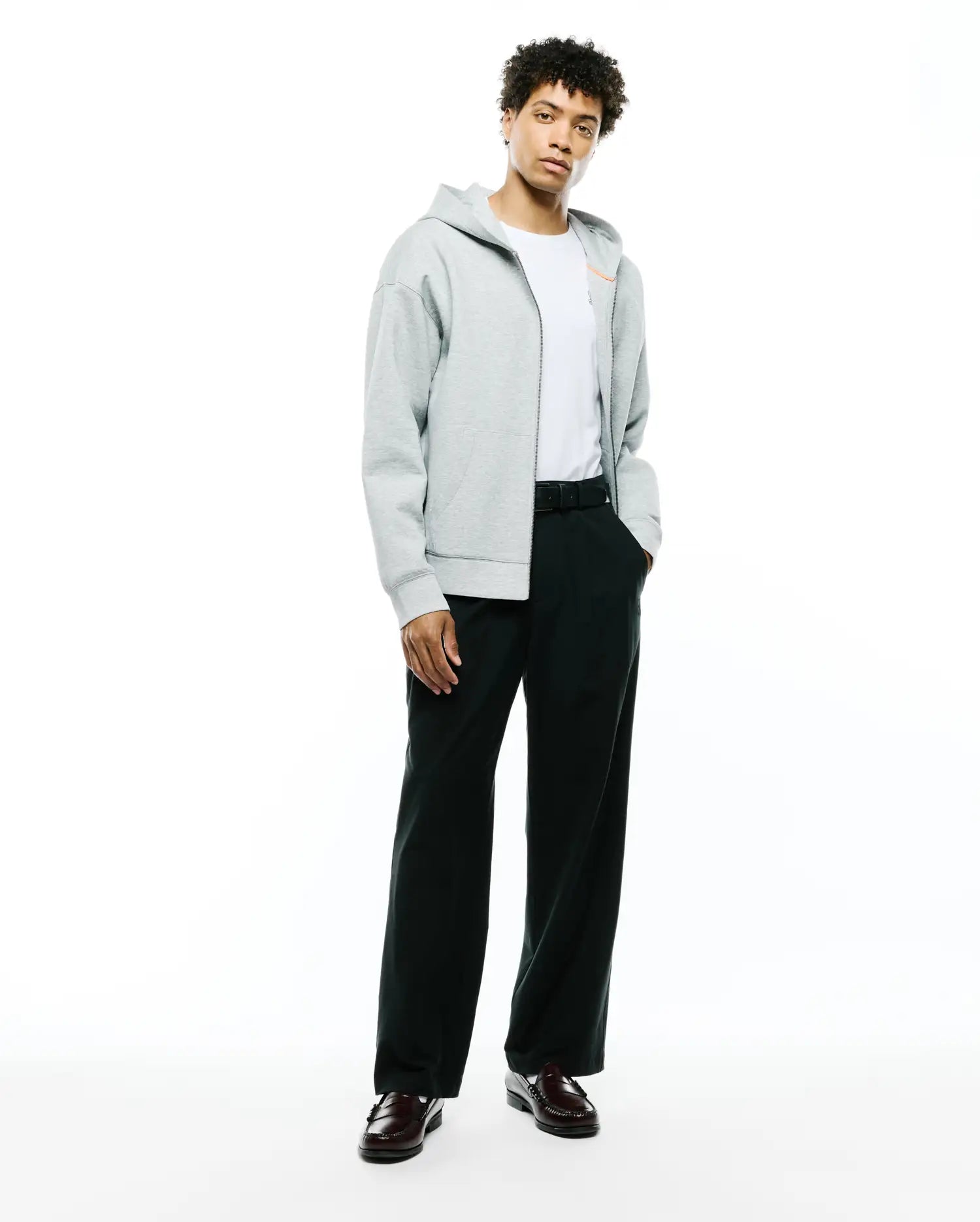 Mens Jonathan Zip Hoodie, a relaxed fit heather grey French terry full-zip hoodie featuring an orange zipper pull, drawstring hood, kangaroo pockets, and a small embroidered Psycho Bunny skull logo on the left chest. (4)