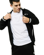 Men's Jacques Pique Track Jacket, black, featuring a full zip, white ribbed collar, striped cuffs, side stripe, and embroidered Psycho Bunny script on sleeve, layered over a white tee with a pink bunny skull logo. (4)