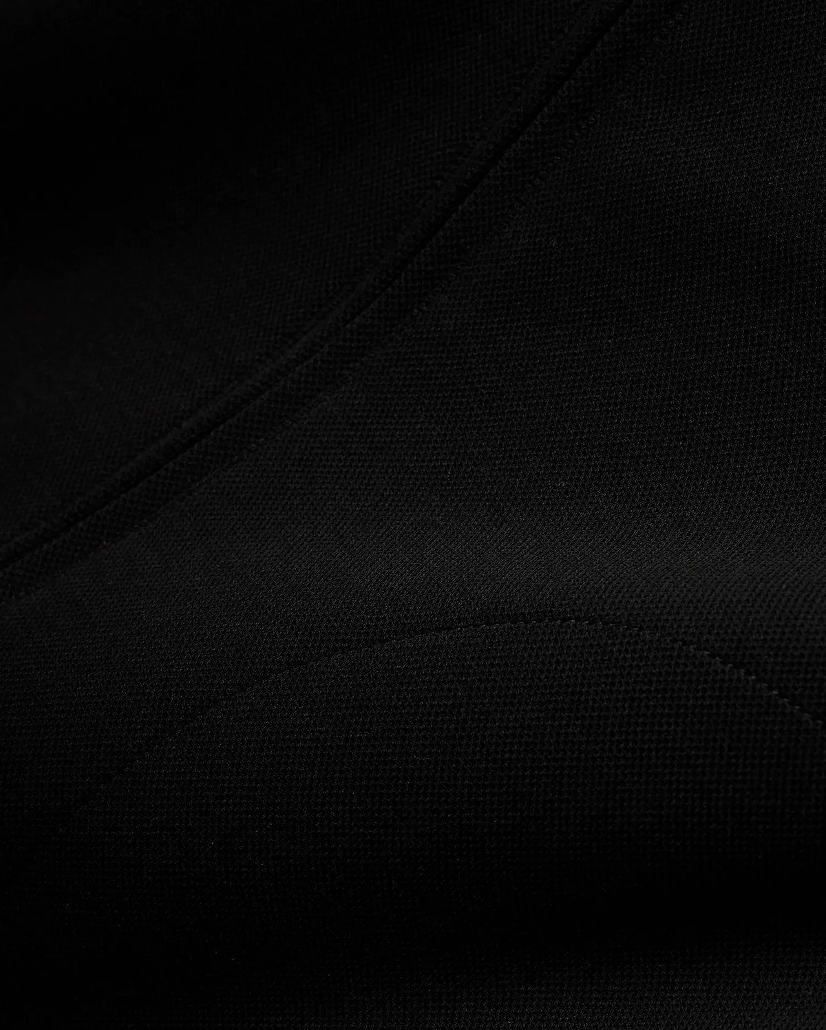 Men's Jacques Pique Track Jacket, a premium black garment crafted from a distinctive pique knit fabric, showcasing its refined texture and precise stitching for a sophisticated streetwear aesthetic. (6)