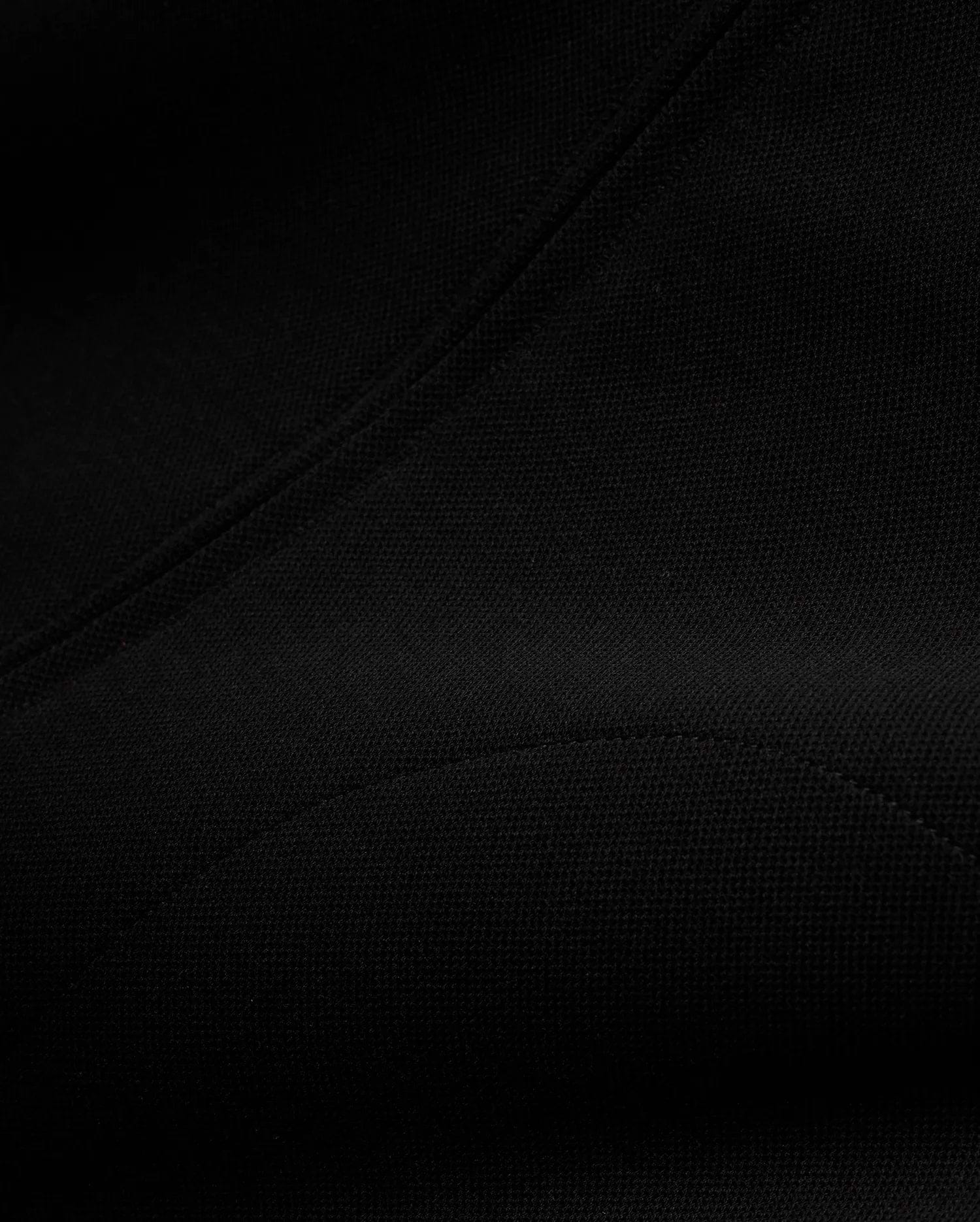 Men's Jacques Pique Track Jacket, a premium black garment crafted from a distinctive pique knit fabric, showcasing its refined texture and precise stitching for a sophisticated streetwear aesthetic. (6)