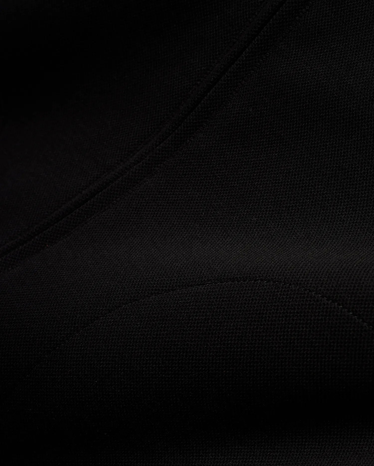 Men's Jacques Pique Track Jacket, a premium black garment crafted from a distinctive pique knit fabric, showcasing its refined texture and precise stitching for a sophisticated streetwear aesthetic. (6)