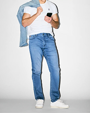 Premium white jersey t-shirt with small embroidered pink/black Psycho Bunny skull logo on chest, paired with slim-fit Mens Ace Knit Denim Pant in light blue, and a light wash denim jacket.