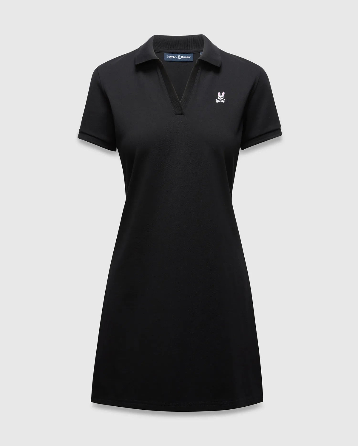 Women's Clara Pique Dress, black classic fit pique dress with a polo collar, V-neck, short sleeves, and a small white and pink embroidered Psycho Bunny skull logo on the left chest.