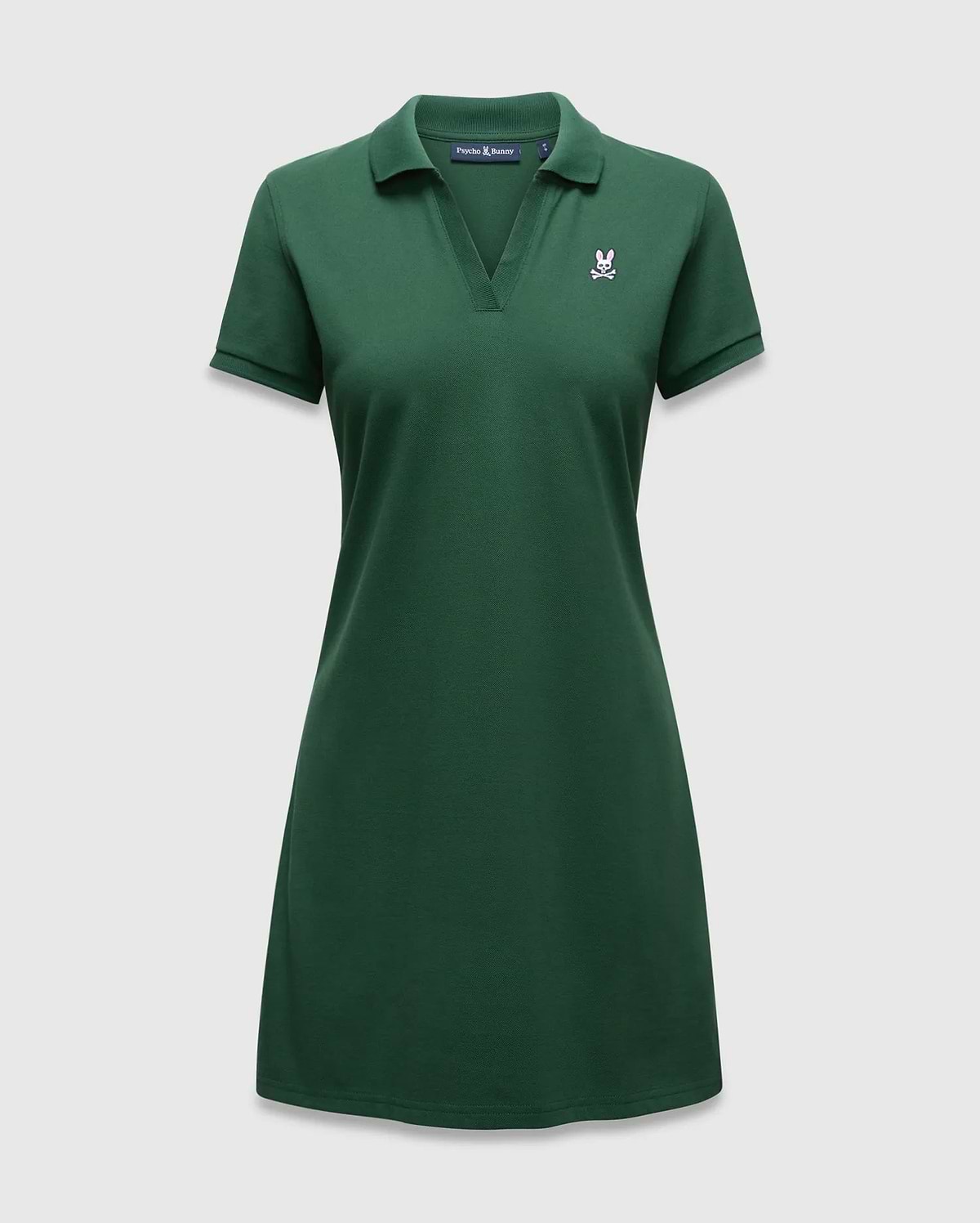 Women's Clara Pique Dress in dark green, featuring a classic fit, pique knit fabric, polo collar, V-neck, and a small embroidered pink Psycho Bunny skull logo on the left chest. (5)