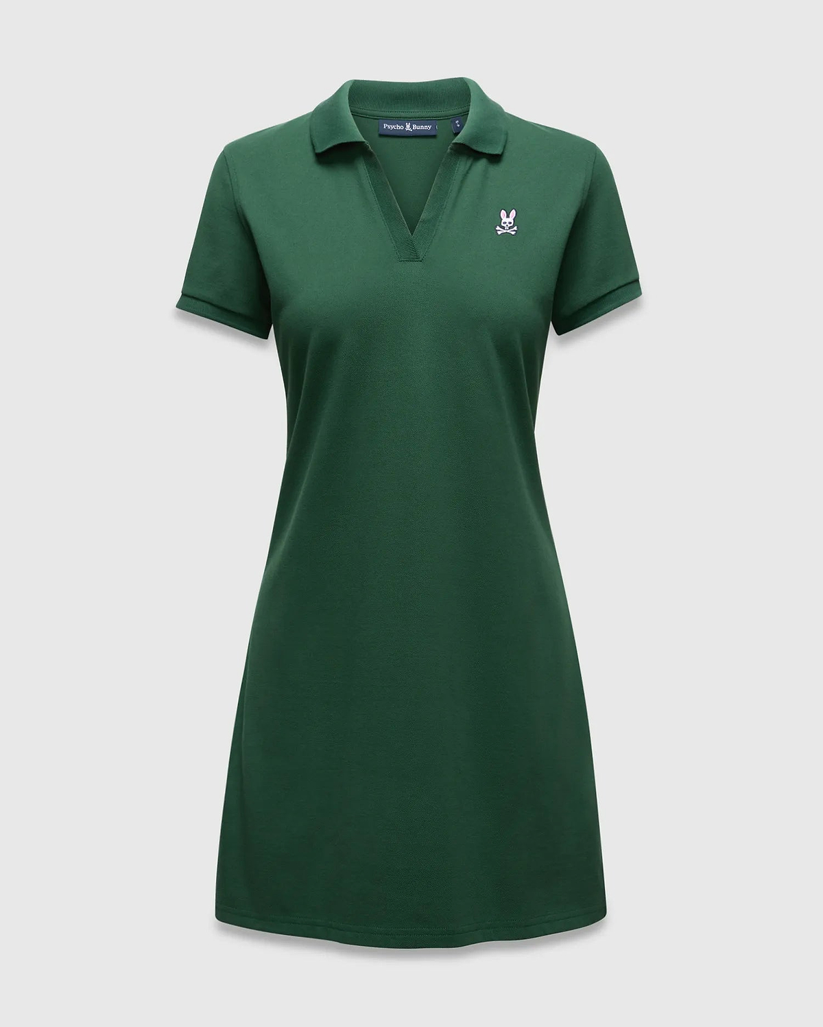 Women's Clara Pique Dress in dark green, featuring a classic fit, pique knit fabric, polo collar, V-neck, and a small embroidered pink Psycho Bunny skull logo on the left chest. (5)