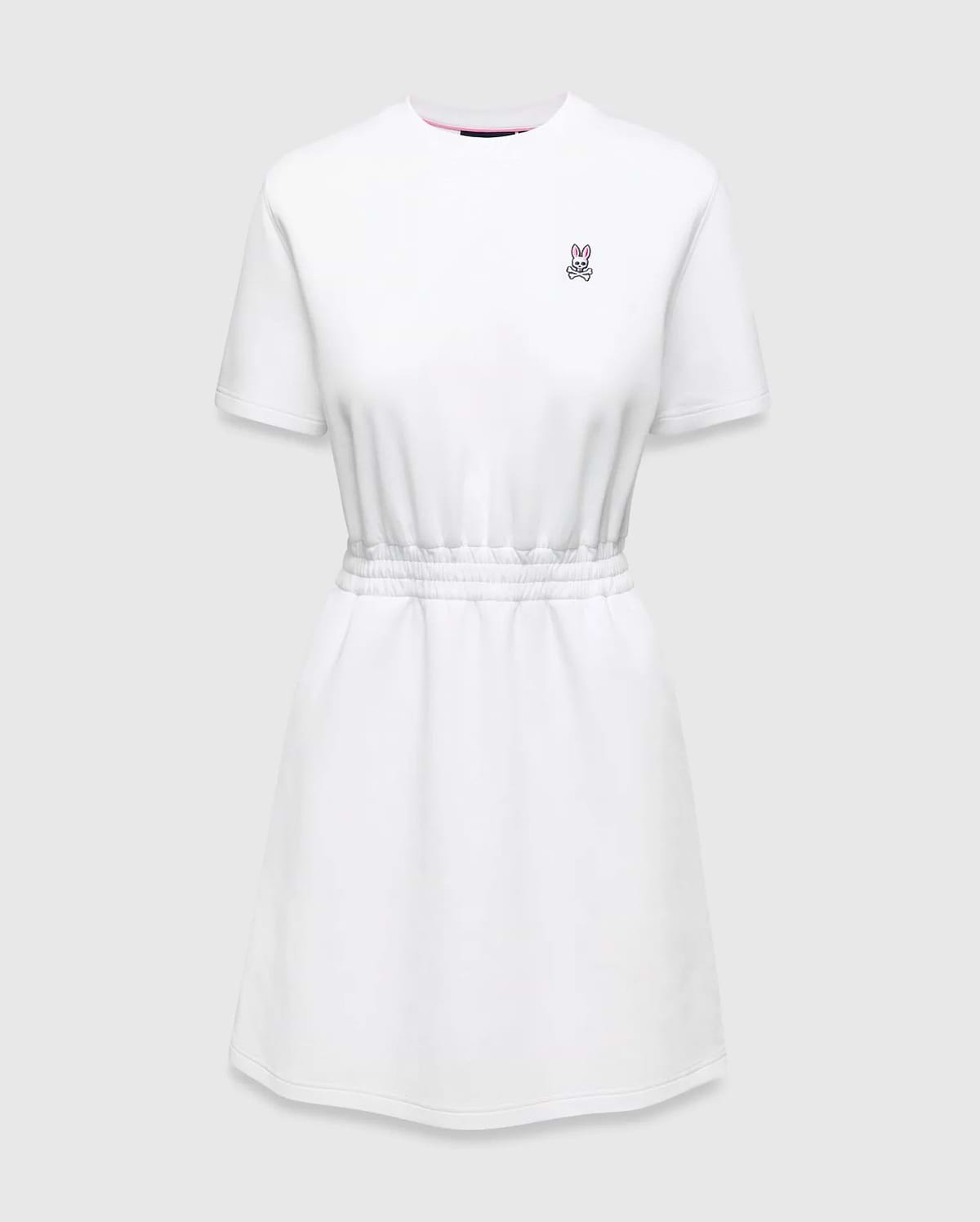 Womens Penelope Dress: White jersey dress with a relaxed fit, elasticated waist, and small pink embroidered Psycho Bunny skull logo on the left chest, accented with a pink neckline trim.