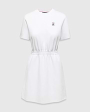 Womens Penelope Dress: White jersey dress with a relaxed fit, elasticated waist, and small pink embroidered Psycho Bunny skull logo on the left chest, accented with a pink neckline trim.