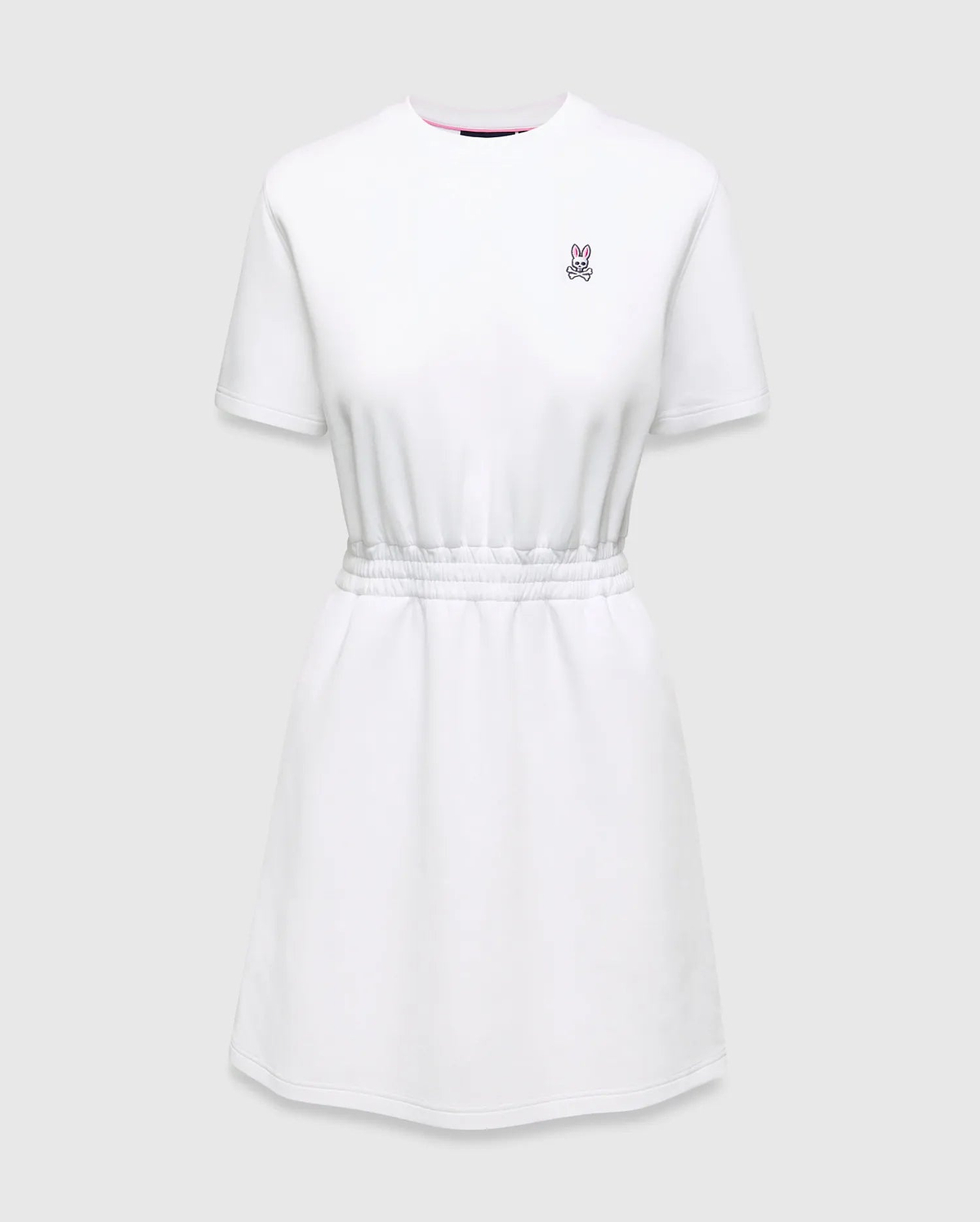 Womens Penelope Dress: White jersey dress with a relaxed fit, elasticated waist, and small pink embroidered Psycho Bunny skull logo on the left chest, accented with a pink neckline trim.
