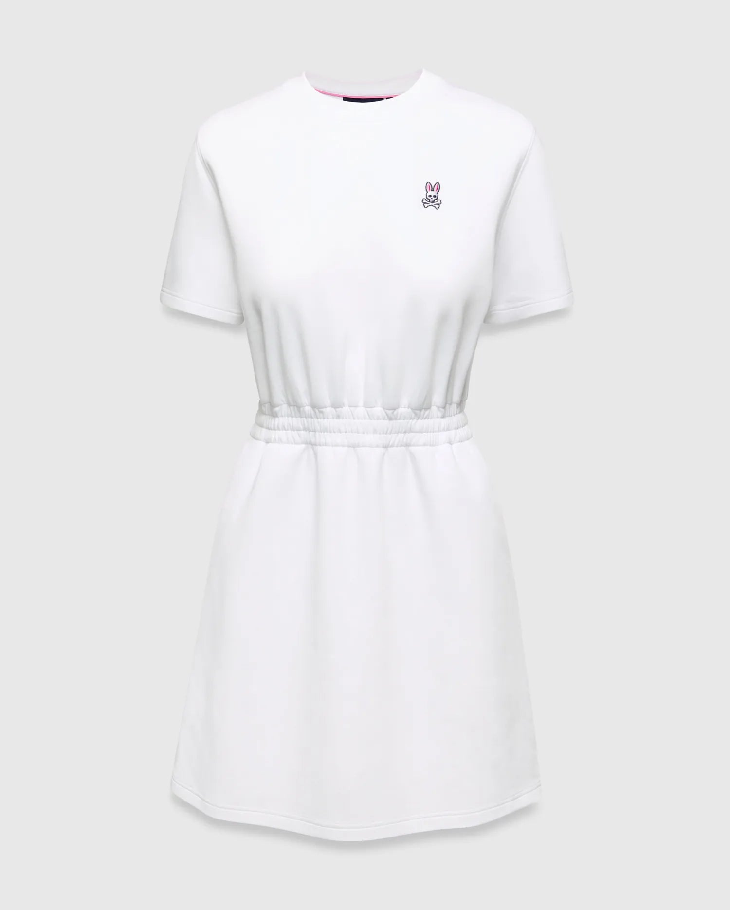 Womens Penelope Dress: White jersey dress with a relaxed fit, elasticated waist, and small pink embroidered Psycho Bunny skull logo on the left chest, accented with a pink neckline trim.