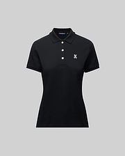 The Psycho Bunny WOMENS PIQUE POLO - WT0100003 is a black short-sleeve women's polo with a collar, three white buttons, and a small 4k-stitch embroidered Bunny logo on the left chest, shown on a plain gray background.