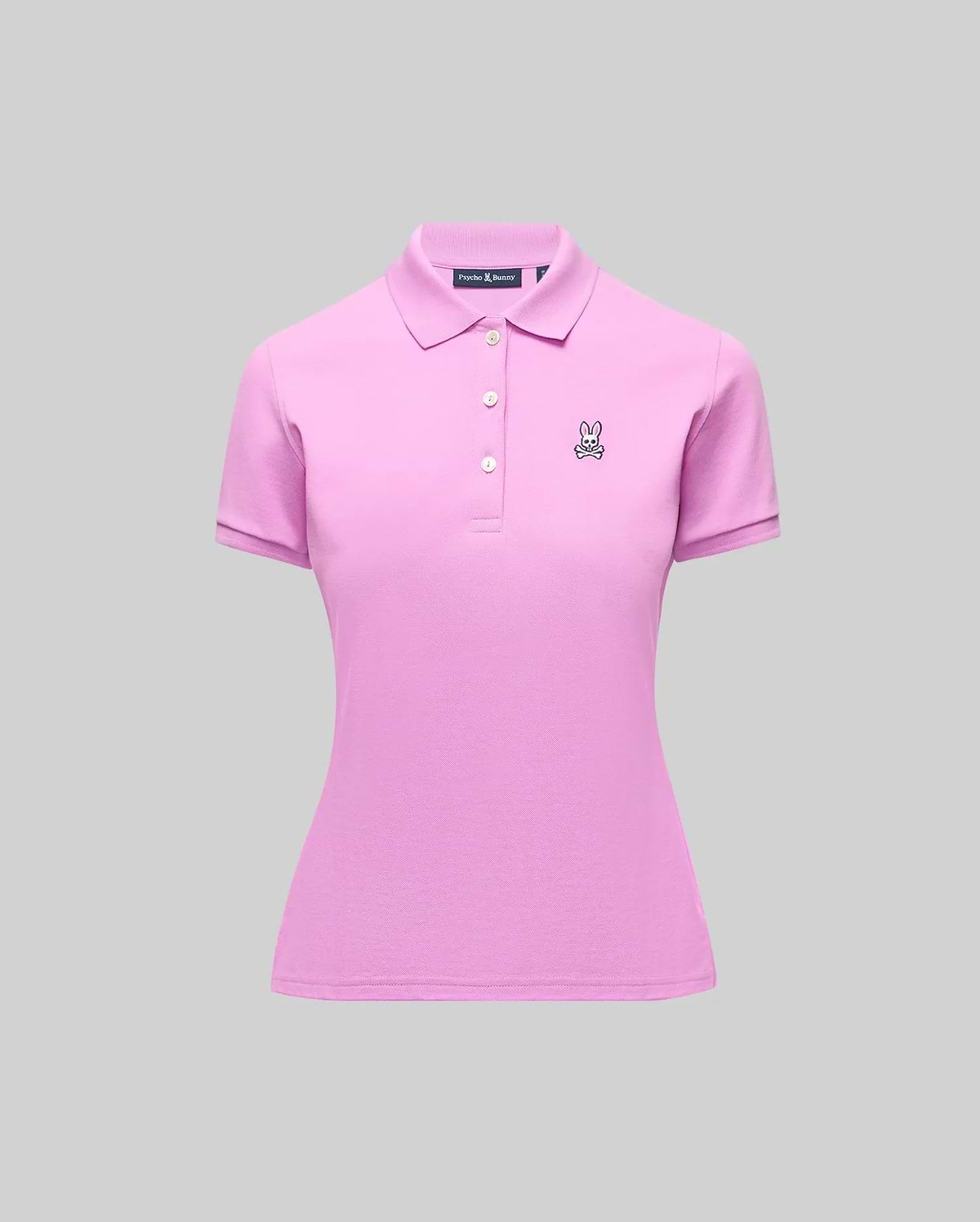 Womens Pique Polo, a slim fit pink pique knit shirt with a 3-button placket, ribbed collar/cuffs, and a small embroidered black/white Psycho Bunny skull logo on the left chest.