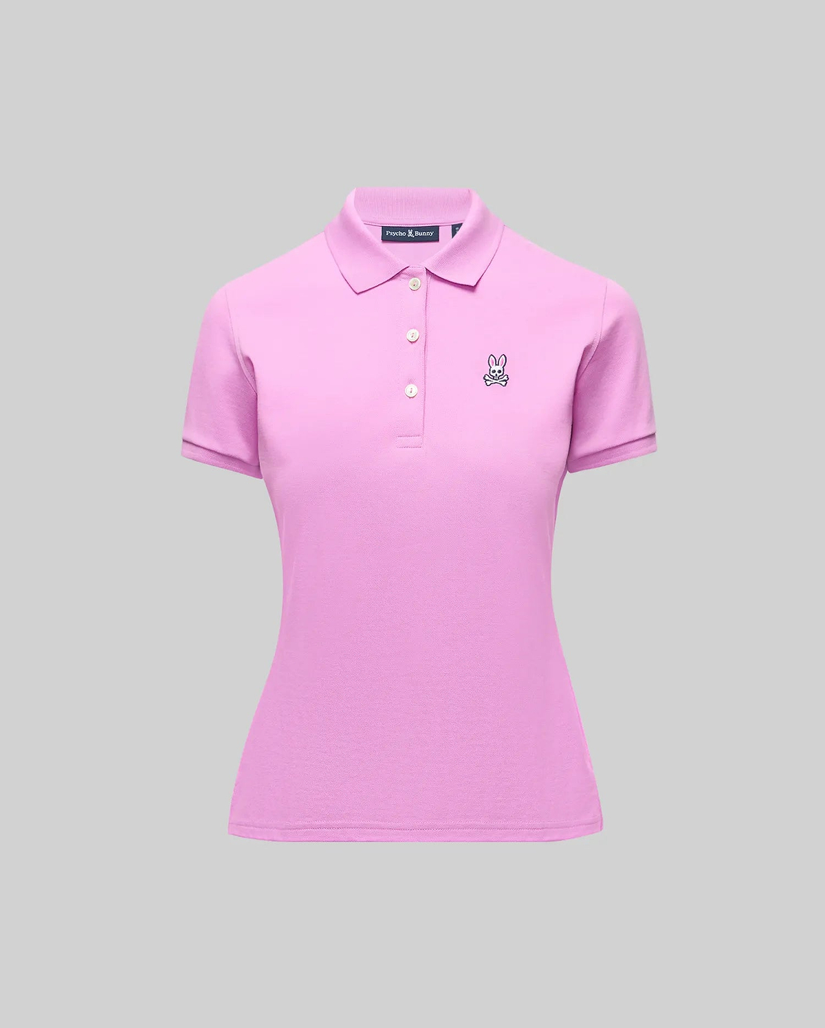 Womens Pique Polo, a slim fit pink pique knit shirt with a 3-button placket, ribbed collar/cuffs, and a small embroidered black/white Psycho Bunny skull logo on the left chest.