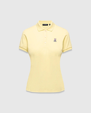 Women's Classic Pique Polo in pale yellow, featuring a classic fit, pique knit fabric, and a small embroidered pink and purple Psycho Bunny skull logo on the left chest.