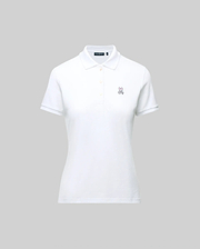 The WOMENS PIQUE POLO - WT0100003 by Psycho Bunny is a white short-sleeve polo featuring a collar, button placket, and 4k-stitch embroidered Bunny logo on the left chest, shown on a plain gray background.