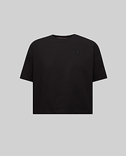 Women's Camille Oversized Fit Tee, a black oversized jersey knit t-shirt featuring a small embroidered black Psycho Bunny skull logo on the left chest and pink neck tape.