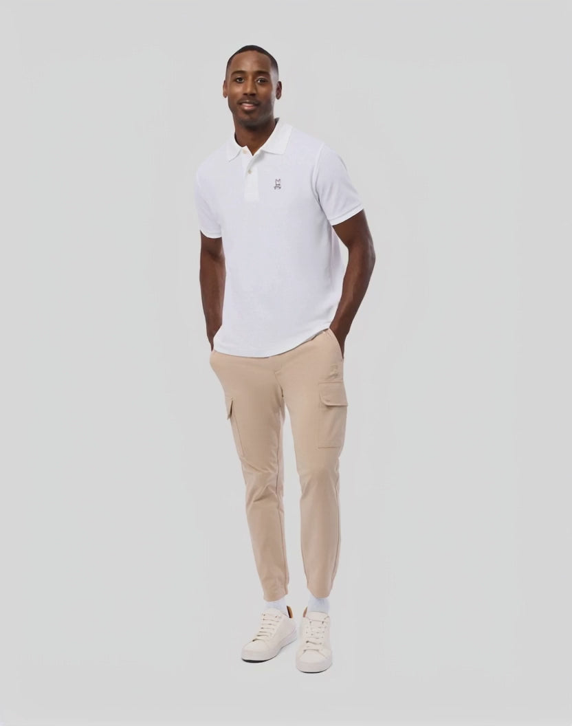 Mens Lloyd Cargo Jogger in sleek black, featuring a relaxed fit, smooth cotton blend fabric, functional cargo pockets, elastic cuffs, and a subtle embroidered Psycho Bunny skull logo on the left thigh.