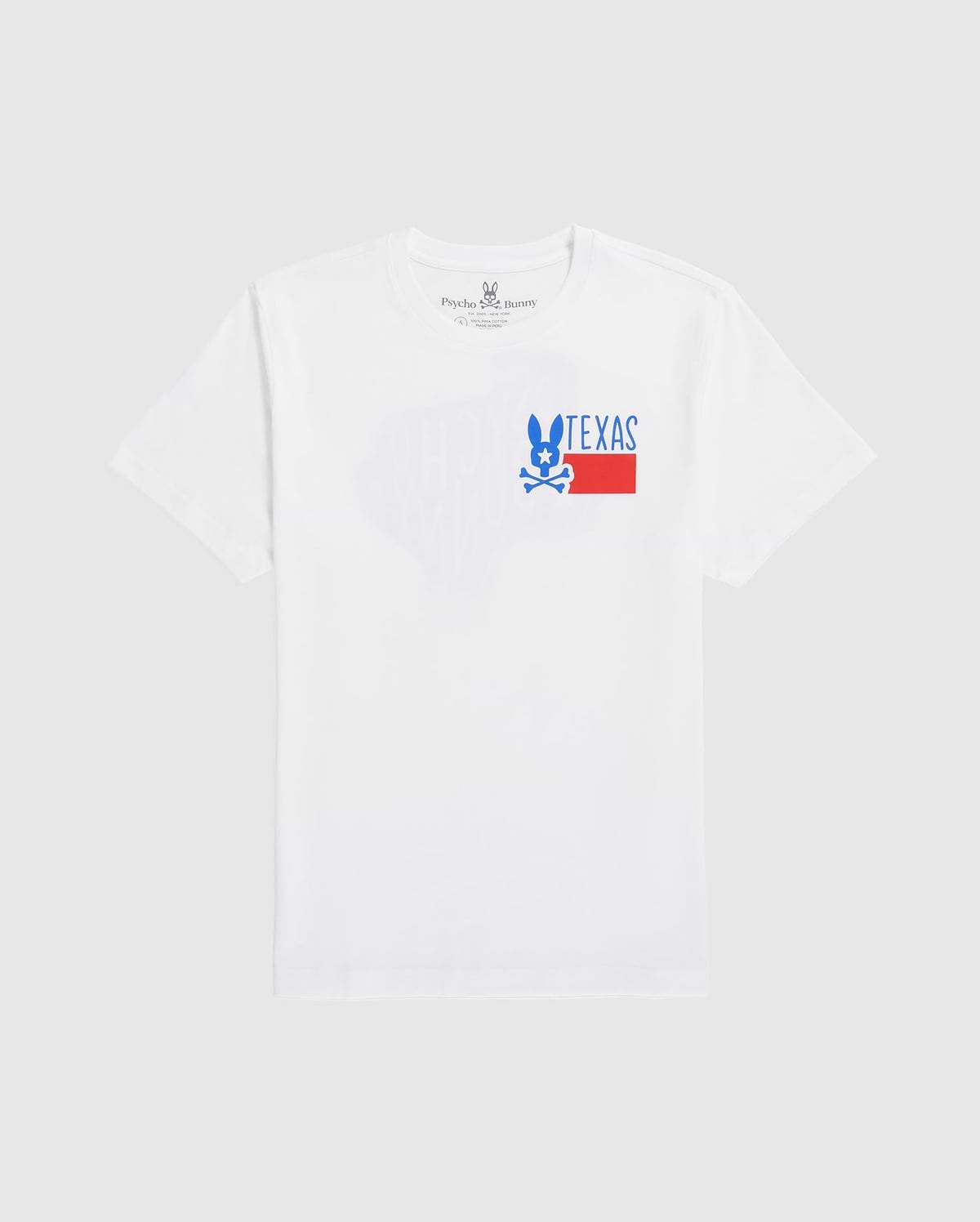 A plain white men's Psycho Bunny Texas tee laid flat, featuring a graphic print with the word "TEXAS" in block letters and a stylized blue and red design underneath, positioned slightly off-center towards the left.